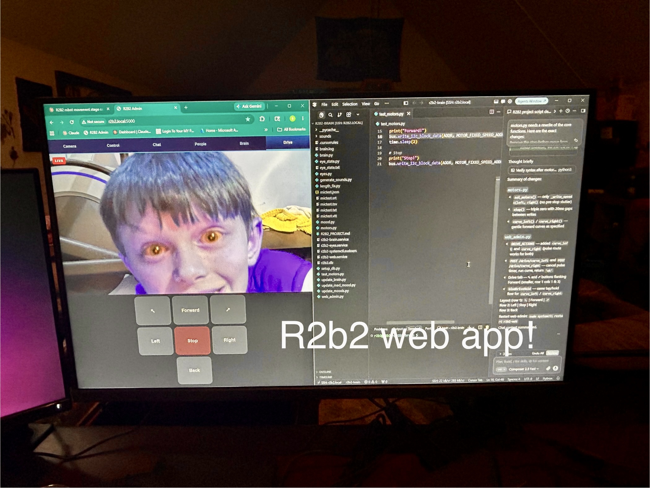 Monitor showing R2B2 web admin with live camera and drive controls alongside code editor